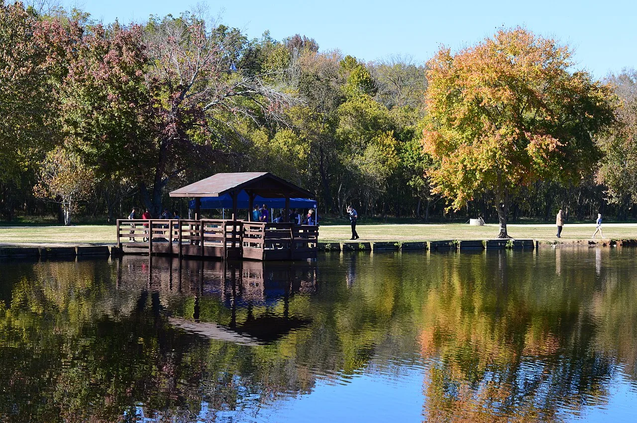 Dock and trees by the water at McAlpine Creek Greenway in Charlotte